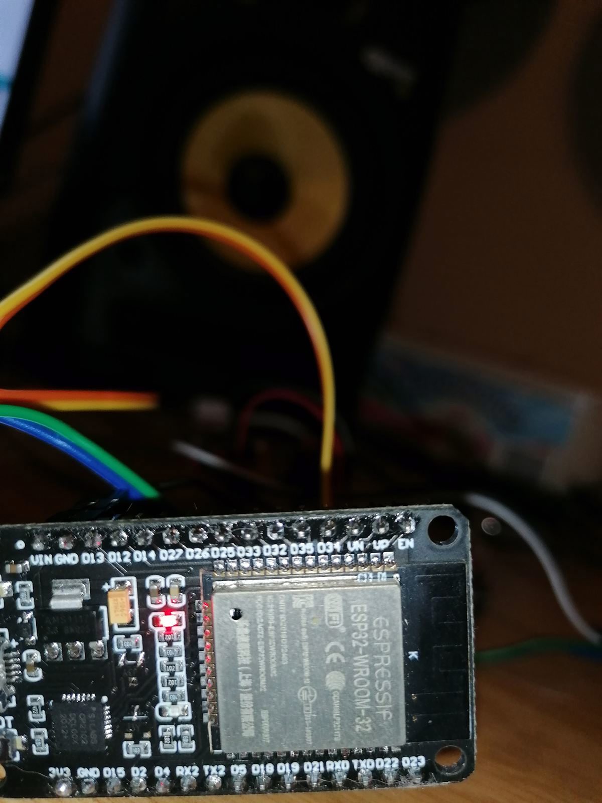 Close-up of the ESP32 dev board, red power LED lit, jumper wires everywhere