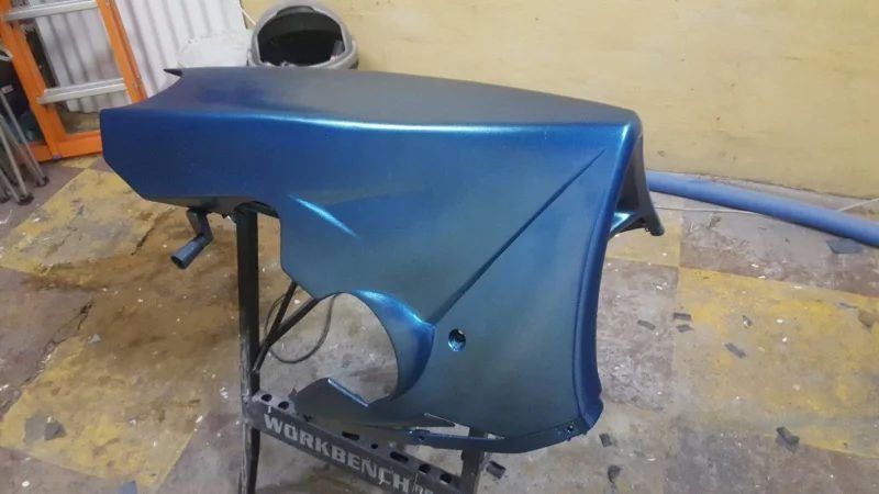 A fairing panel sprayed in metallic blue