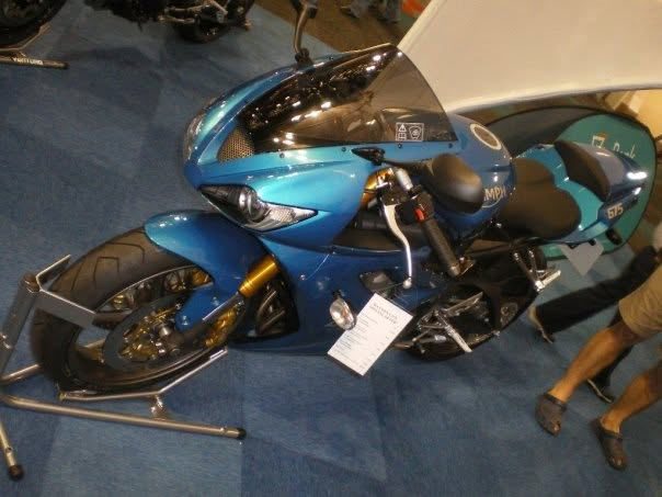 A blue Triumph Daytona on a stand at the AMID bike show in 2008