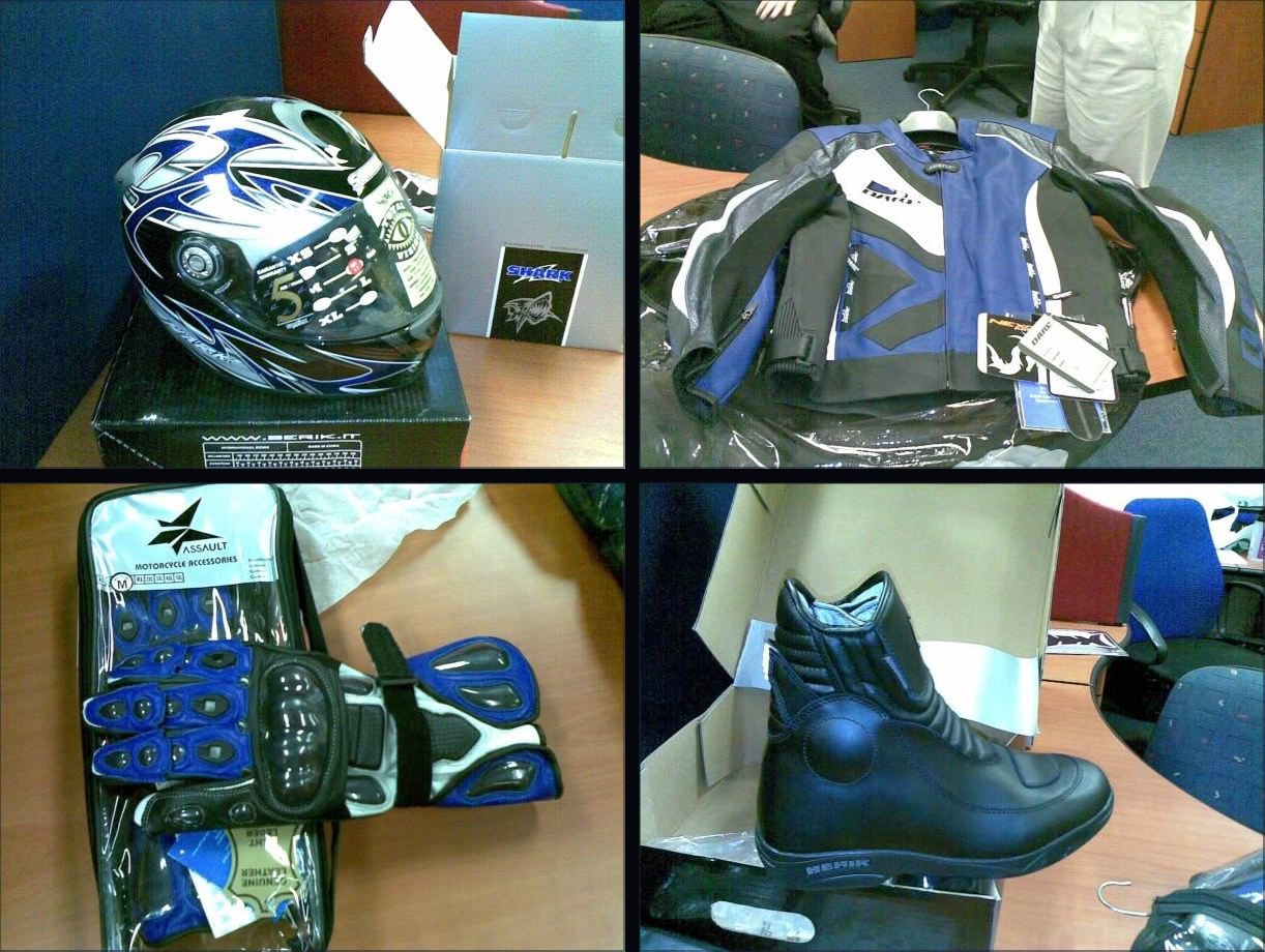 Four photos of brand new motorcycle gear laid out on an office desk with the tags and boxes still on: a blue and black full-face helmet, a blue, black and white leather jacket, armoured blue and black gloves still in their case, and a pair of black leather boots in an open box